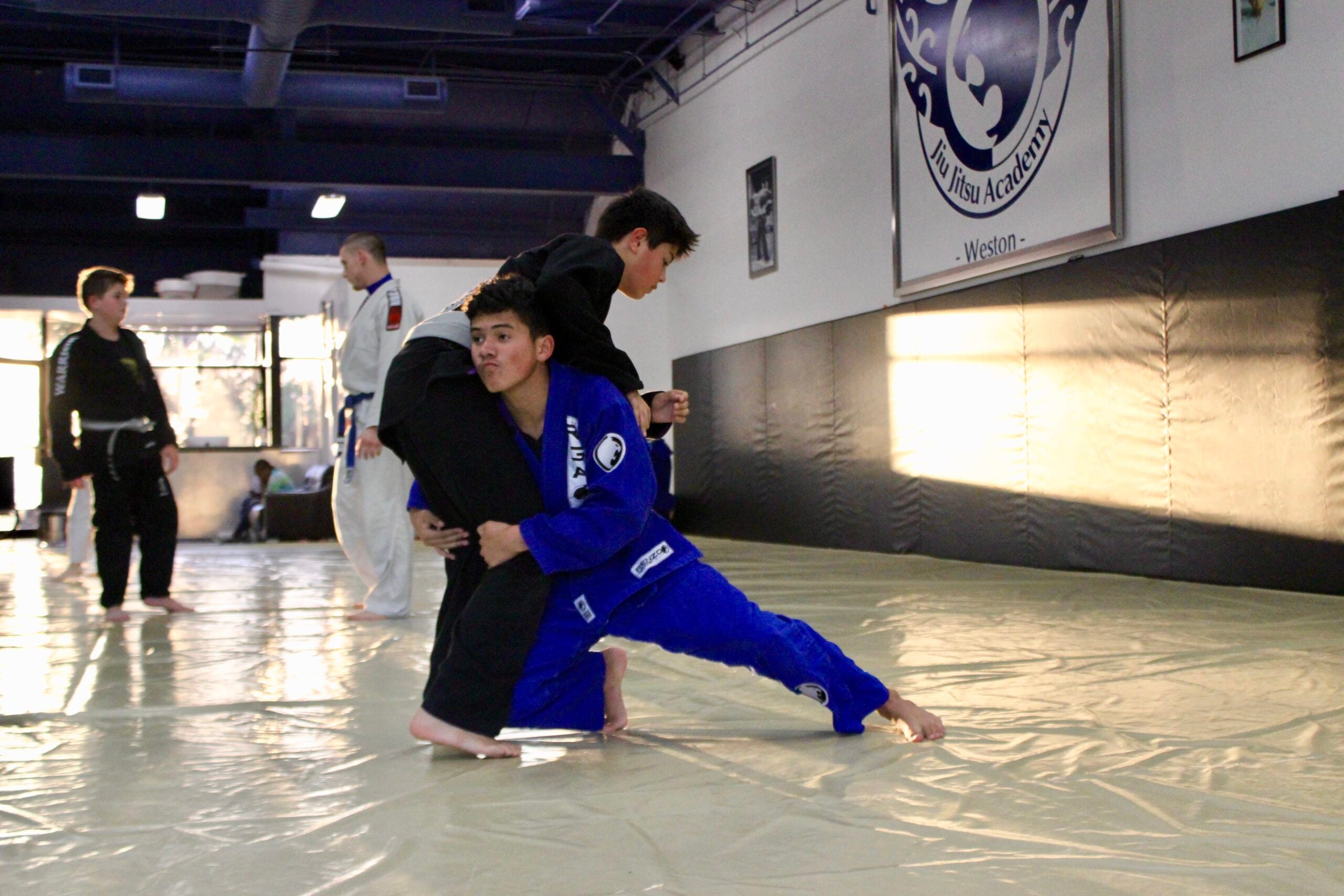 teenagers double leg takedown